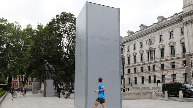 A statue of British wartime Prime Minister Winston Churchill has been boarded up amid fears of clashes between anti-racism protesters and far-right groups. Picture: Tolga Akmen/AFP