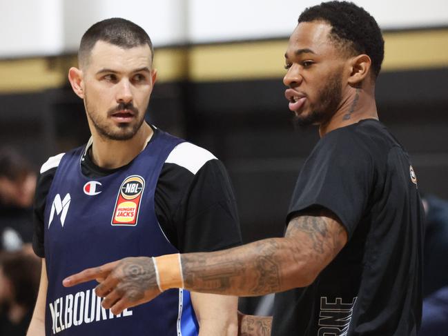 Goulding and new import Rayjon Tucker talk shop at Hoops City. Picture: Brendan Beckett