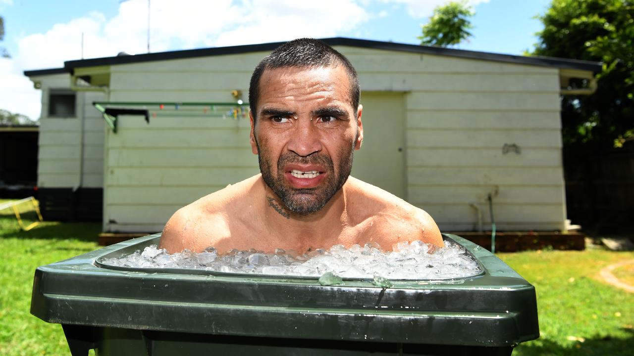 Australian boxer Anthony Mundine takes an ice bath inside a garbage bin during his Brisbane media call.