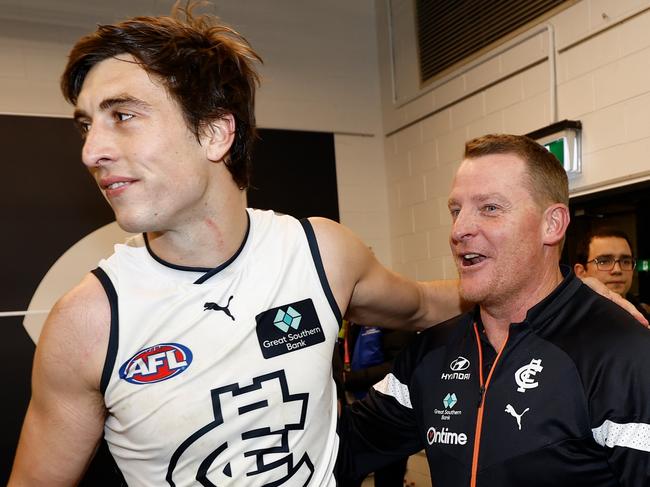 MELBOURNE, AUSTRALIA - AUGUST 6: Caleb Marchbank of the Blues and Michael Voss, Senior Coach of the Blues celebrate during the 2023 AFL Round 21 match between the St Kilda Saints and the Carlton Blues at Marvel Stadium on August 6, 2023 in Melbourne, Australia. (Photo by Michael Willson/AFL Photos via Getty Images)