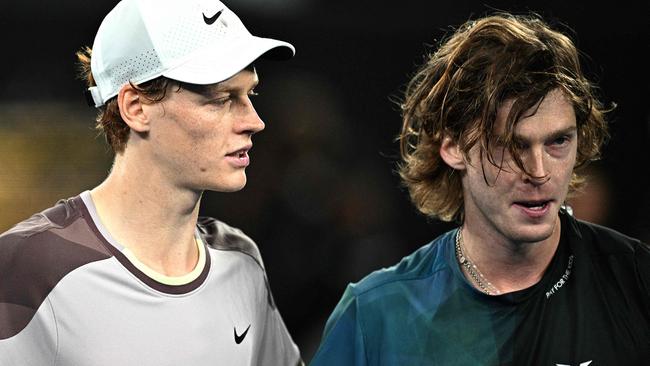 Italy's Jannik Sinner embraces Russia's Andrey Rublev after their men's singles quarter-final at the Australian Open.