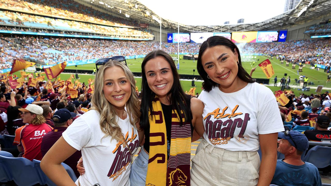 Georga Boegheim, Alexandra Dalton, and Lily Cubby from Brisbane get ready for the NRL Grand Final at Accor Stadium, Sydney Olympic Park. Pics Adam Head