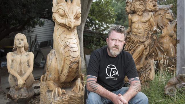 Chainsaw carver Leigh Conkie is angry with Nillumbik Council plans to sell land next to his property. Picture: Ellen Smith