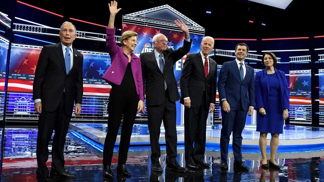 Democratic presidential candidates (L-R) former New York City Mayor Mike Bloomberg, Elizabeth Warren, Bernie Sanders, Joe Biden, Pete Buttigieg and Amy Klobuchar onstage at the start of the Democratic presidential primary debate at Paris Las Vegas.