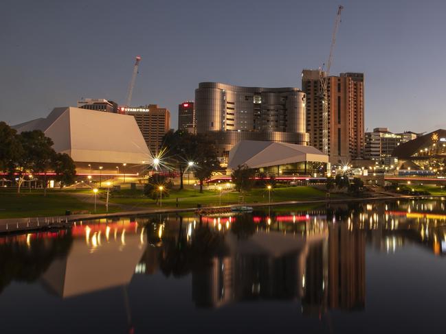 The Super Pink Moon rising over the Adelaide CBD (riverbank) on Wednesday, April 8. Picture Simon Cross