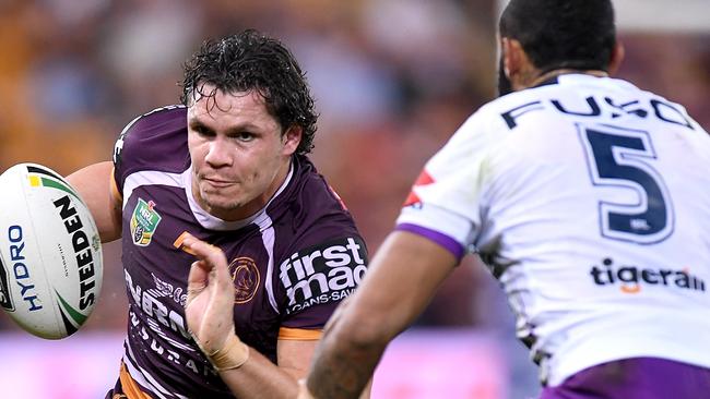 BRISBANE, AUSTRALIA - APRIL 20: James Roberts of the Broncos takes on the defence during the round seven NRL match between the Brisbane Broncos and the Melbourne Storm at Suncorp Stadium on April 20, 2018 in Brisbane, Australia. (Photo by Bradley Kanaris/Getty Images)