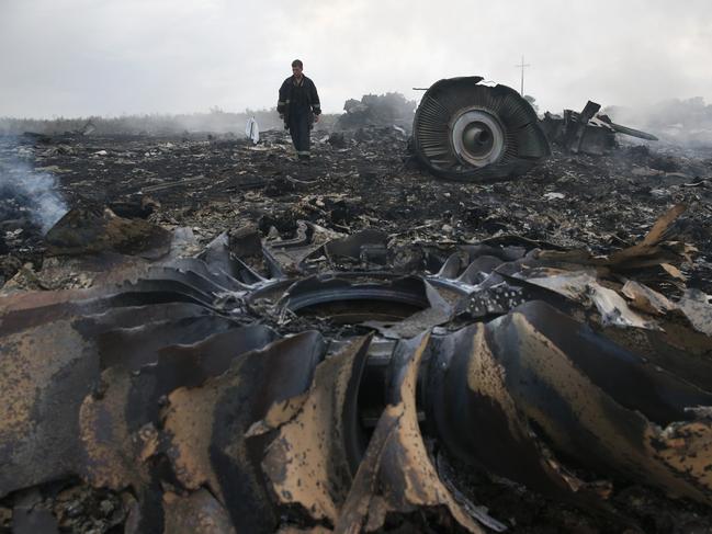 An Emergencies Ministry member walks at a site of a Malaysia Airlines Boeing 777 plane crash near the settlement of Grabovo in the Donetsk region. Picture: Reuters