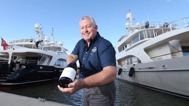 GC City Marina boss and Superyacht Rendezvous Organiser Trenton Gay with the line up of seven of the 20-plus superyachts coming for the event behind him. Photo by Richard Gosling.