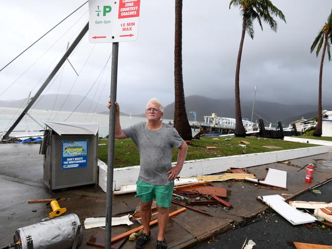 Local council worker Brian Doyle inspects damage at Shute Harbour, Airlie Beach, Wednesday, March 29, 2017. Picture: AAP Image/Dan Peled