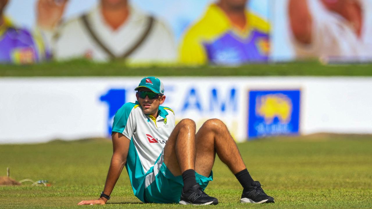 Australia's Ashton Agar rests during a practice session at the Galle International Cricket Stadium in Galle on June 28, 2022, ahead of their two Tests cricket matches against Sri Lanka. (Photo by ISHARA S. KODIKARA / AFP)