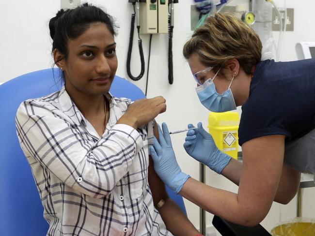 A volunteer in the UK is injected with either an experimental COVID-19 vaccine or a comparison shot as part of the first human trials to test a potential vaccine. Picture: AP