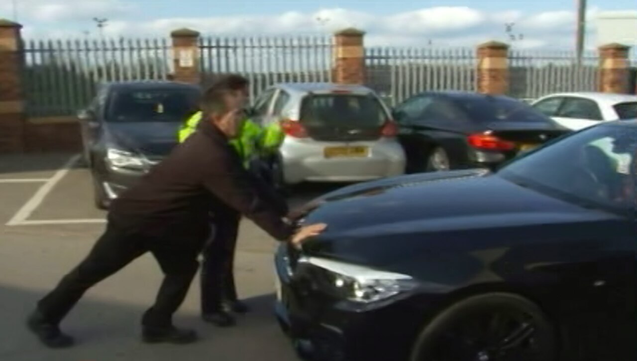 This is the moment police stopped Joey Barton from leaving Barnsley's stadium after 'assaulting' their manager