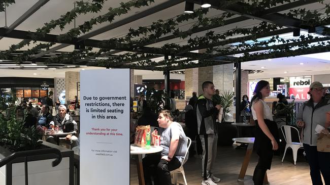 People observe social distancing inside Westfield Hurstville as the NSW government tightens restrictions due to the outbreak from Victoria spreading to areas of Sydney.