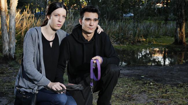 Georgina Holliday with her partner Vaughn Page at Musgrave Dog Park. Georgina believes her dog, one-year-old Kiko was poisoned at the park. She found him near the pond laying down, unable to move. Photo: Jerad Williams