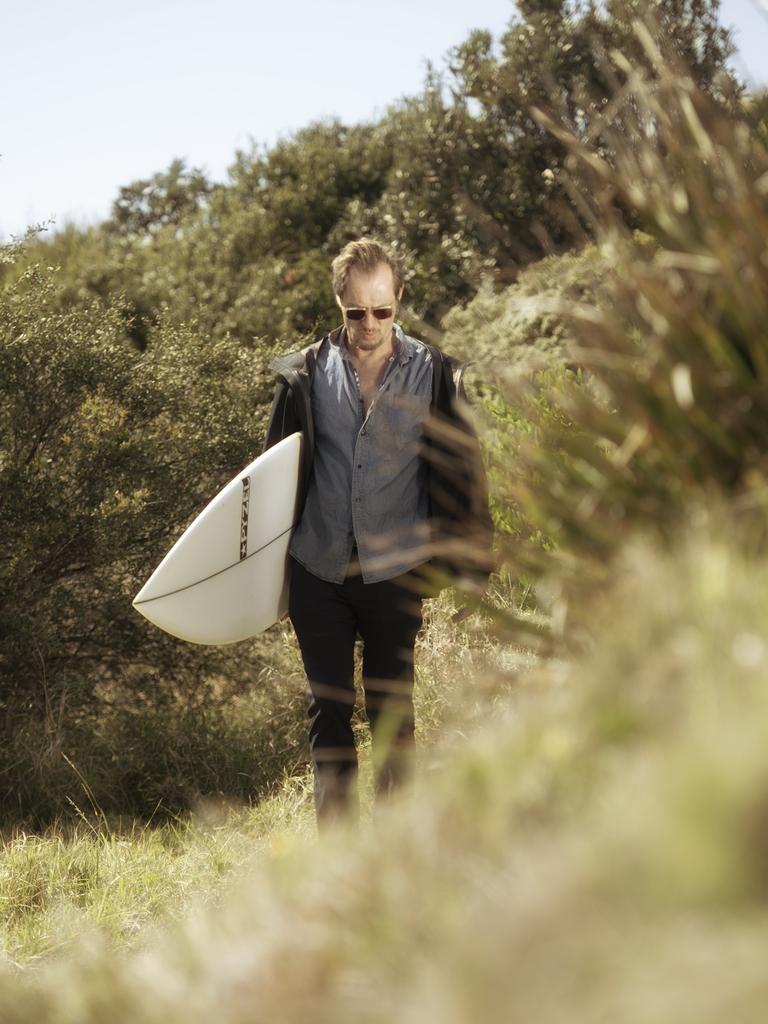 Tognetti heads for the surf. Picture: Nic Walker