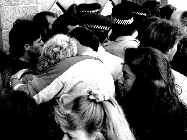 Emotional scenes as crowds wait to enter Terrigal courthouse for the arraignment.