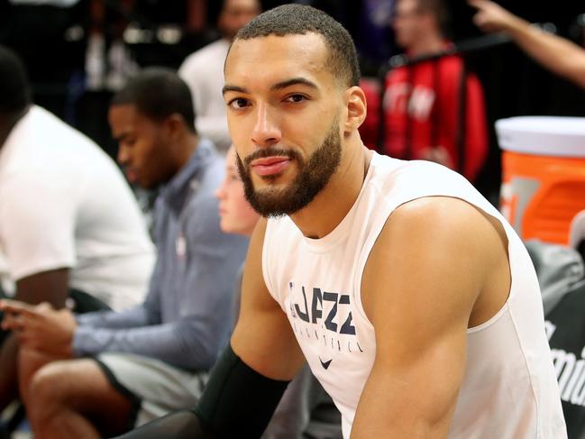 (FILES) In this file photo taken on December 4, 2019  Utah Jazz center Rudy Gobert cools down after warm ups before a NBA game against Los Angeles Lakers in Salt Lake City, Utah. - Some celebrities around the world are affected by the novel coronavirus such as Rudy Gobert. He has been tested positive to the Covid-19. (Photo by GEORGE FREY / AFP)