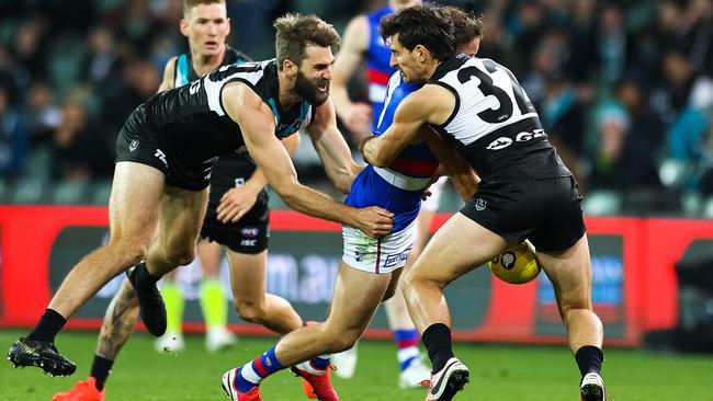 Justin Westhoff and Sam Mayes lay a strong tackle on their Bulldogs opponent. Picture: Daniel Kalisz/Getty Images