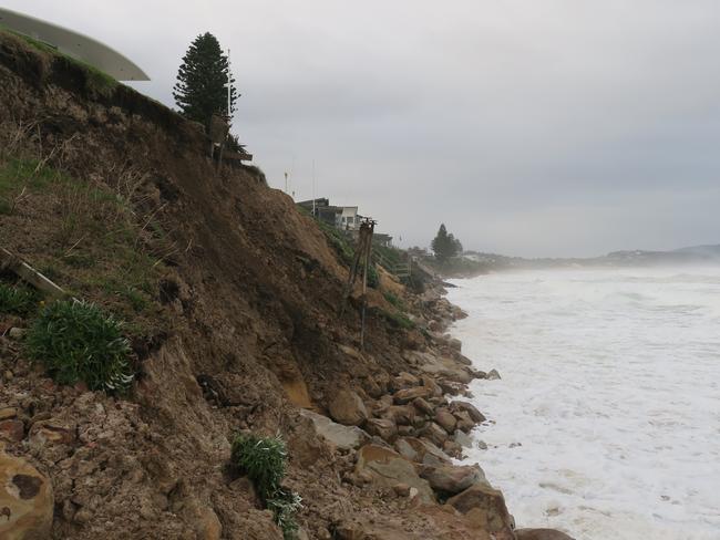 Huge swells have cause massive erosion problems at Wamberal where houses are teetering on the edge. Picture: Richard Noone