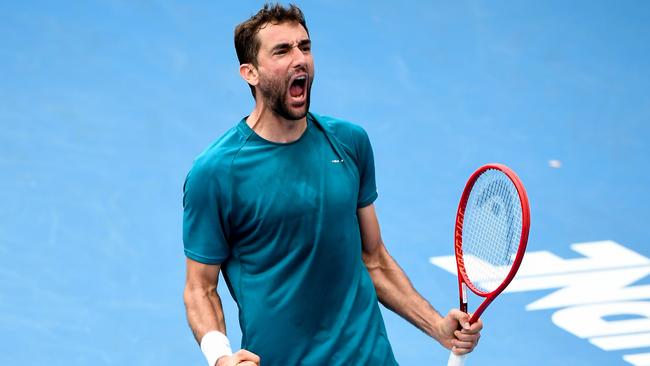 Marin Cilic celebrates his second-round win in five sets over France’s Benoit Paire on Wednesday. Picture: AFP