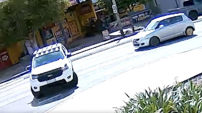 The driver of the Ford Ranger allegedly performed an illegal U-turn after a pedestrian threw a can of soft drink at his car.