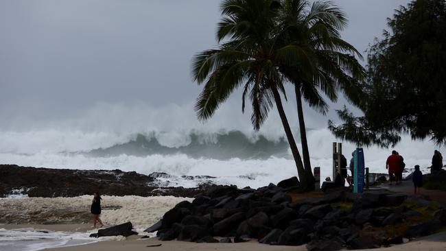 GOLD COAST, AUSTRALIA - MARCH 05: People watch the large waves at Snapper Rocks on March 05, 2025 in Gold Coast, Australia. Tropical Cyclone Alfred is expected to make landfall in southeast Queensland as a Category 2 storm, marking the first time a cyclone has directly hit the region in over 50 years. The storm is forecast to bring damaging winds, heavy rainfall, and potential storm surges, prompting authorities to urge residents to prepare for significant impacts, including flooding and power outages. (Photo by Chris Hyde/Getty Images)