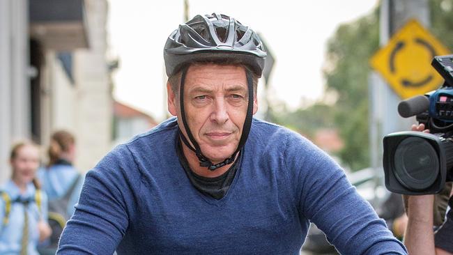 Mark Bomber Thompson leaves his Port Melbourne warehouse the day after being released from Police custody. Picture: Mark Stewart