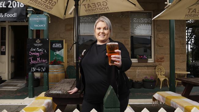 Haley Berry, senior supervisor at the Richmond Arms Hotel in Richmond, shows off some local product. Picture: Nikki Davis-Jones