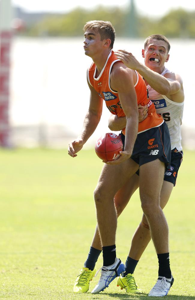 James Leake tackled by Toby McMullin during the GWS Giants match sim. Picture: Phil Hillyard.