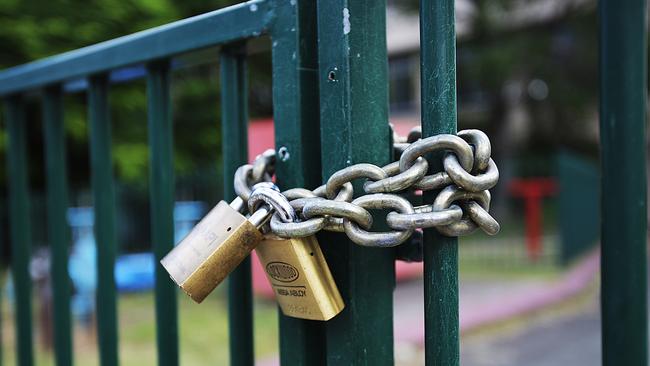 The gates remain locked at Fortitude Valley State School. Picture: Marc Robertson