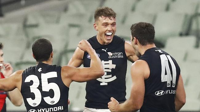 Patrick Cripps enjoys Saturday’s victory with Ed Curnow and Levi Casboult.