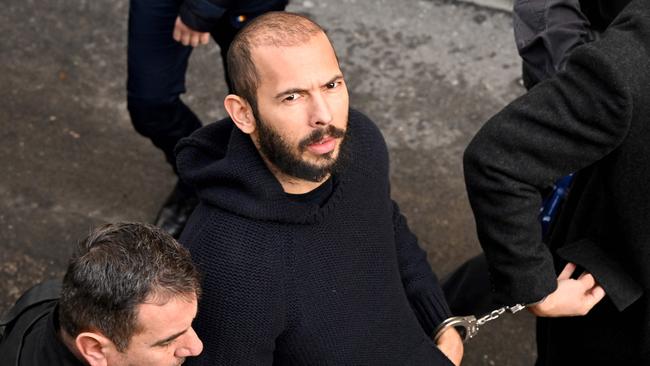 Andrew Tate arriving at court in February for a decision on his appeal against pre-trial detention for alleged human trafficking, rape and forming a criminal group. Picture: Daniel Mihailescu / AFP