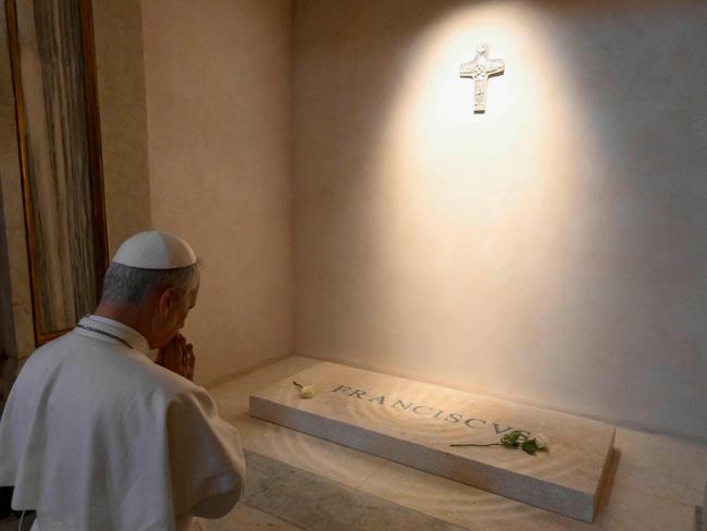 Pope Leo XIV pays his respects to late Pope Francis in front of his tomb at Santa Maria Maggiore Basilica in Rome. Picture: Handout / Vatican Media / AFP