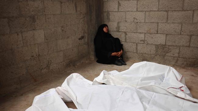 A Palestinian woman mourns the death of several relatives killed in Israeli air strikes. Picture: AFP