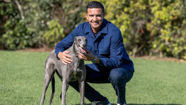 Tim Cahill and his retired greyhound Lumo at his family farm, Northern NSW Picture Danielle Smith