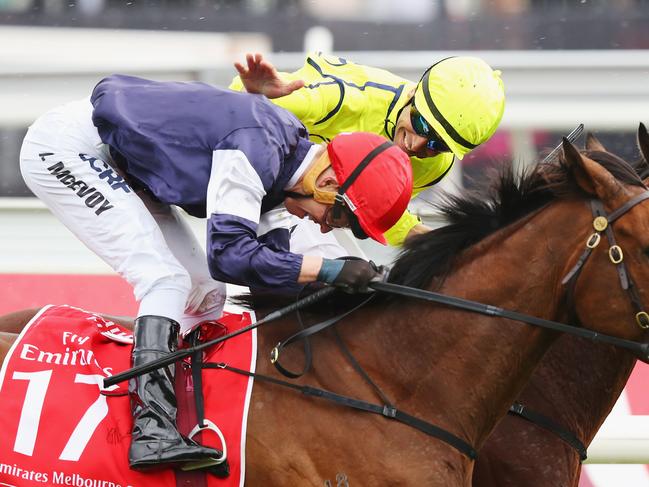 MELBOURNE, AUSTRALIA - NOVEMBER 01: Jockey Kerrin McEvoy riding Almandin wins ahead of Jockey Joao Moreira on Heartbreak City who pats him on the back in race 7 the Emirates Melbourne Cup on Melbourne Cup Day at Flemington Racecourse on November 1, 2016 in Melbourne, Australia. (Photo by Michael Dodge/Getty Images)