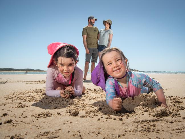 Regan and Jana Diehm with daughters Lexie, 6, and Zahra, 4, on the banks of the Maroochy River, which could be reached in by Fast Rail. Picture: Brad Fleet