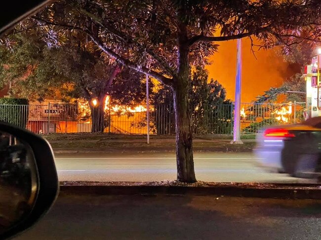 The shops ablaze late on Saturday night. Picture: Nik Drake