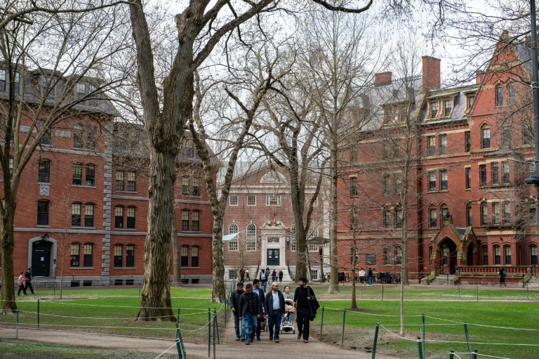 Harvard students march after Trump seeks to cut remaining contracts