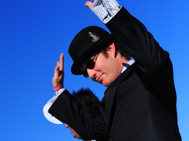 Stewie McLean won the best dressed male at the Dunk Island fashion competition get haggled by Richard Wilkins during 2009 Ladies Day at Cluden Race Track in Townsville.