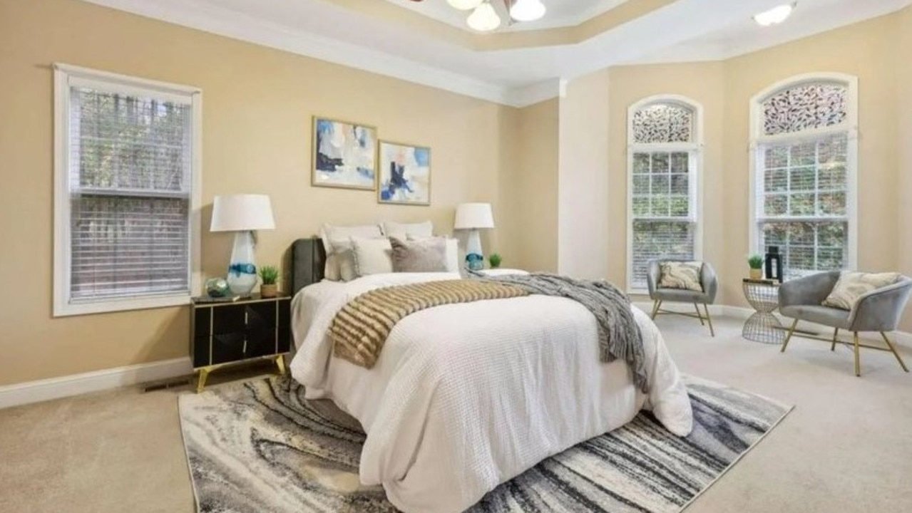 The primary bedroom has a tray ceiling and a sitting area. Picture: Realtor