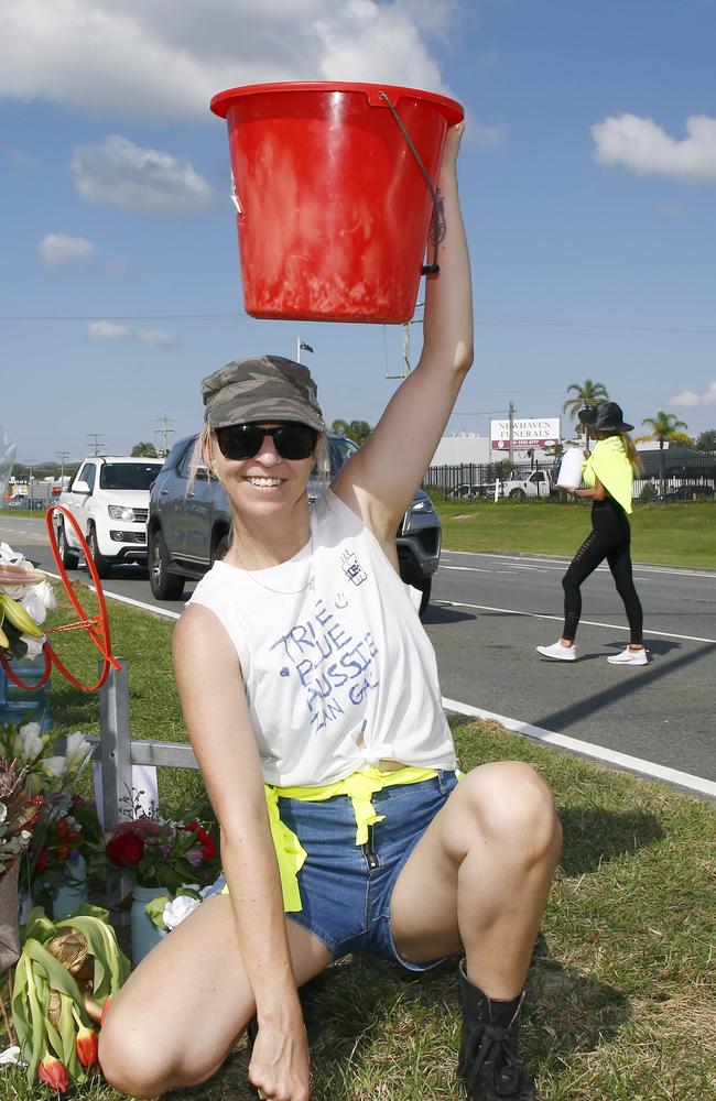 Lisa Collins and Tam Barnett, at the back, raise funds for Ian Gal’s funeral. Picture: Tertius Pickard