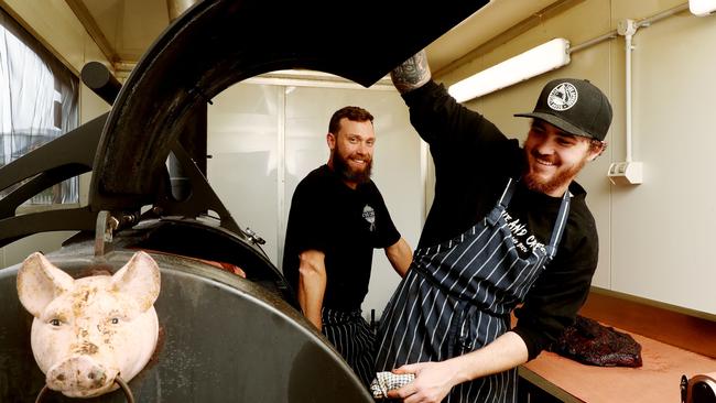 Cue and Crew boys check out that low and slow barbecue. Picture: Sue Graham