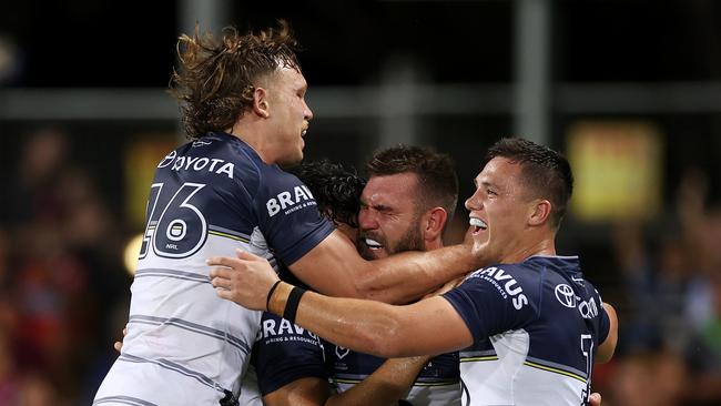 DARWIN, AUSTRALIA – APRIL 30: Kyle Feldt of the Cowboys celebrates with Reuben Cotter, Scott Drinkwater and Jeremiah Nanai of the Cowboys after scoring a try during the round eight NRL match between the Parramatta Eels and the North Queensland Cowboys at TIO Stadium, on April 30, 2022, in Darwin, Australia. (Photo by Mark Kolbe/Getty Images)