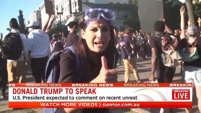 Seven News reporter Amelia Brace after her cameraman were pushed over by riot police during a protest in Washington. Picture: Sunrise