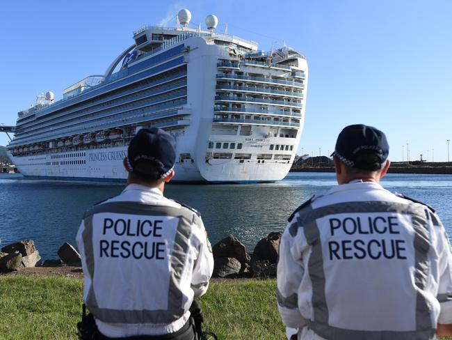 NSW Police Rescue officers look on as the Ruby Princess, with crew only on-board, docks at Port Kembla, Wollongong. Picture: AAP