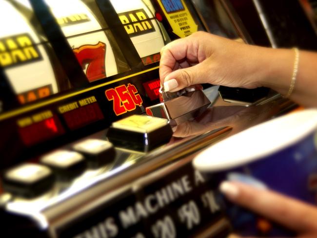 Hands playing slot machine