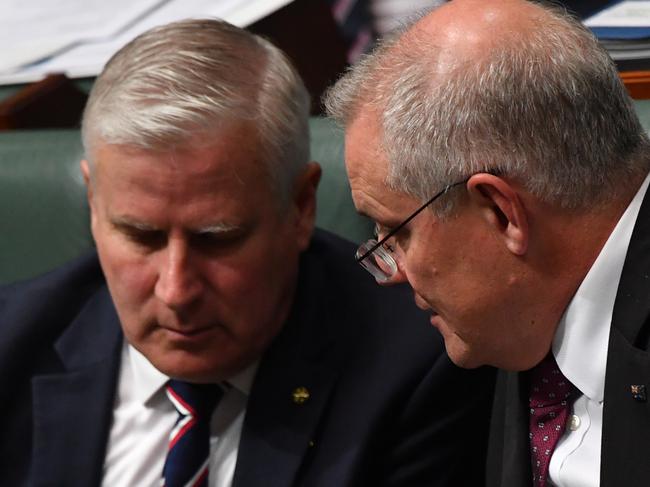 CANBERRA, AUSTRALIA - MARCH 23: Deputy Prime Minister Michael McCormack (left) and Prime Minister Scott Morrison during Question Time in the House of Representatives at Parliament House on March 23, 2021 in Canberra, Australia. The federal government was yesterday set back by new allegationsÃÂ broadcastÃÂ by the Ten Network after pixelated images of unnamed Coalition advisers allegedly engaging in performing lewd sex acts on the desks of female MPs resulting in a Morrison staff member being sacked last night. Additionally, the ABC Network aired a first hand account by an Australian Parliament security guard of what she witnessed on the night Brittany Higgins was allegedly raped in the office of then-defence industry minister Linda Reynolds in early 2019. (Photo by Sam Mooy/Getty Images)