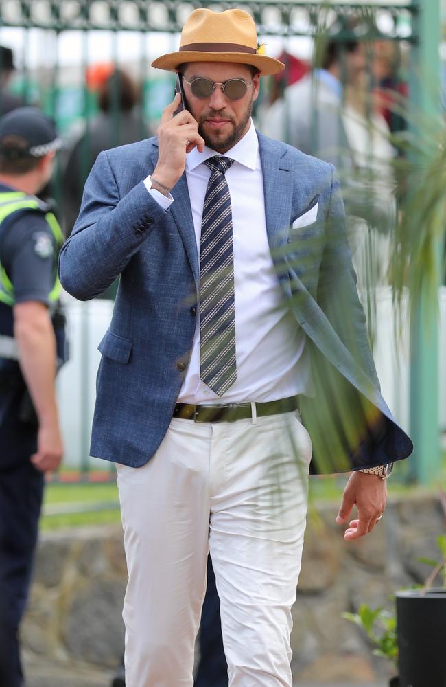 Lance Franklin takes a call during Caulfield Cup Day. Picture: Alex Coppel.