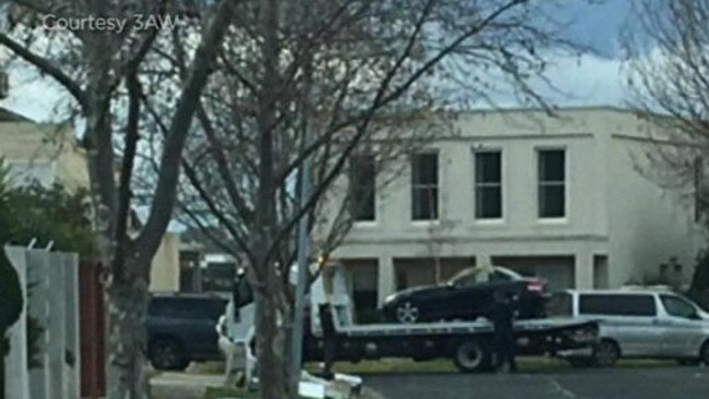 Police tow black a Mercedes from the home of Borce Ristevski. Picture: 3AW